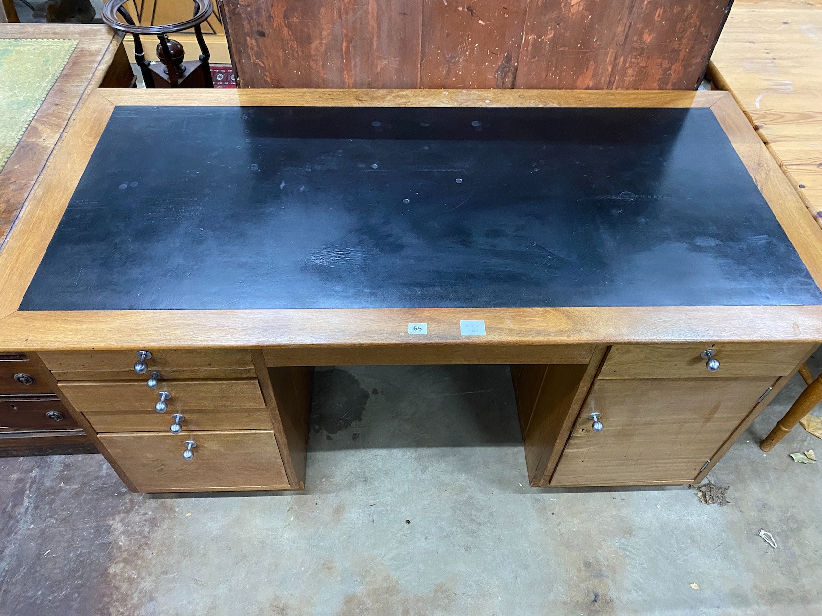 A mid century teak kneehole desk, length 152cm, depth 76cm, height 76cm